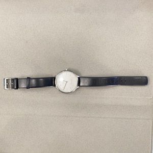 Skagen watch with leather straps.